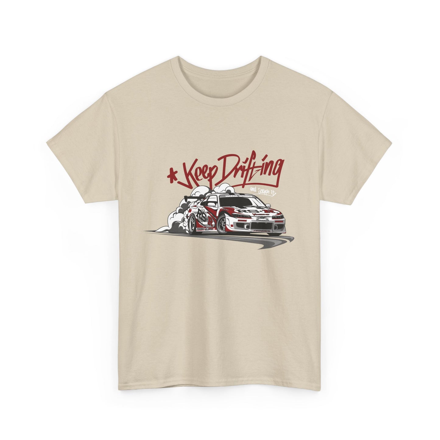 A beige t-shirt with a graphic print of a car drifting on a street, accompanied by the text 'Keep Drifting'.