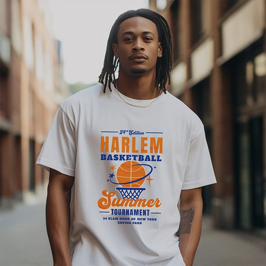Man wearing a white t-shirt with Harlem Basketball Summer Tournament design on a blurred street background