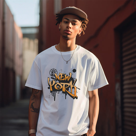 Person wearing a white t-shirt with 'New York' graphic design outdoors.