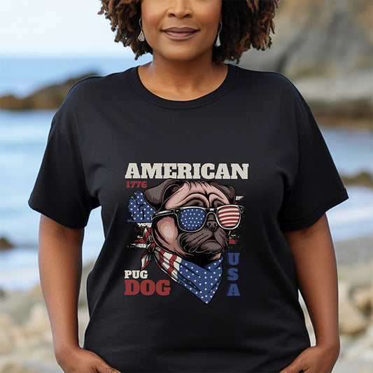 Person wearing a black t-shirt with an 'American Pug Dog USA' design on a beach.