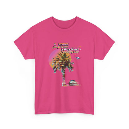 A heliconia pink t-shirt with a retro Las Vegas glitch graphic featuring a palm tree, a sunset, and UFOs over a desert landscape.