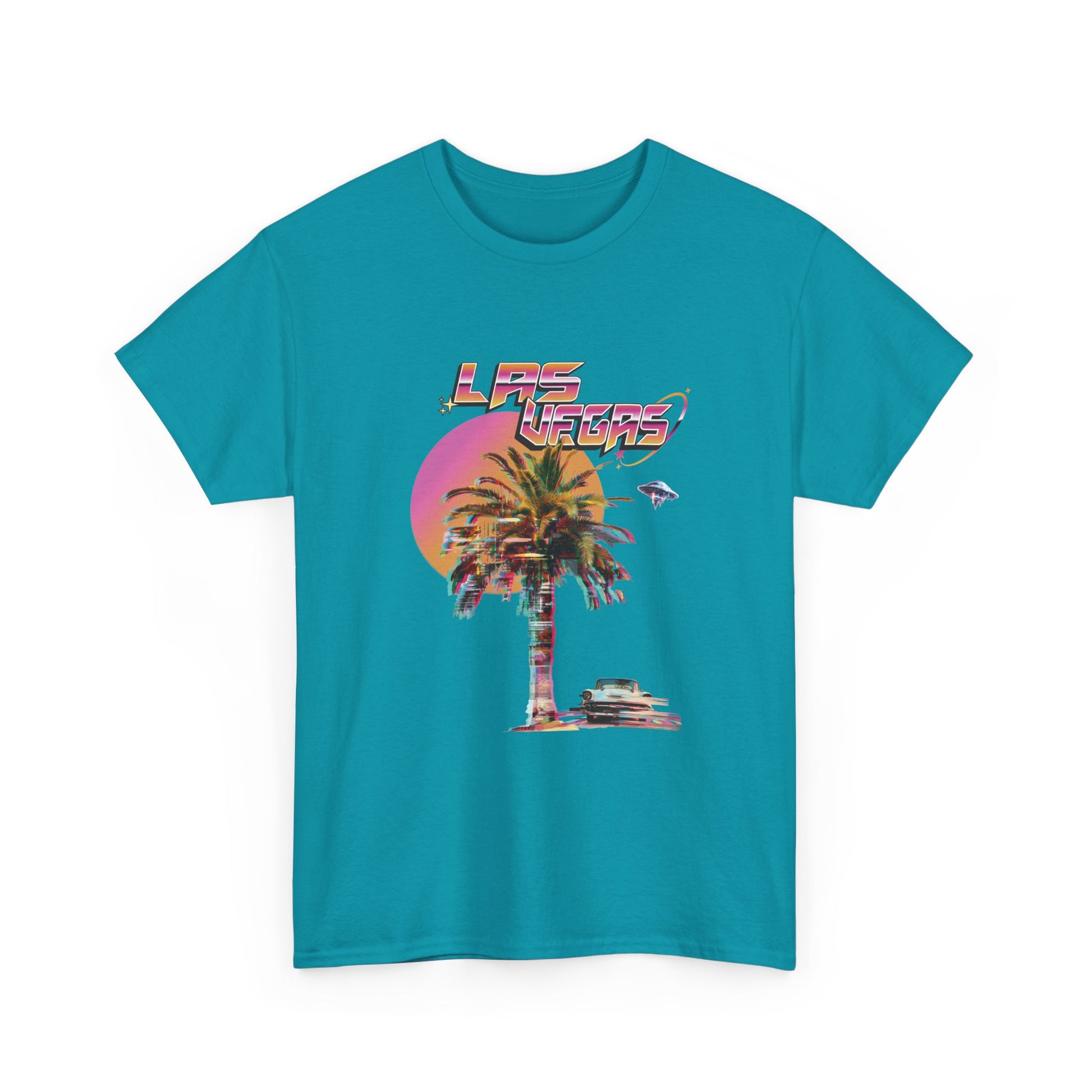 A tropical blue t-shirt with a retro Las Vegas glitch graphic featuring a palm tree, a sunset, and UFOs over a desert landscape.