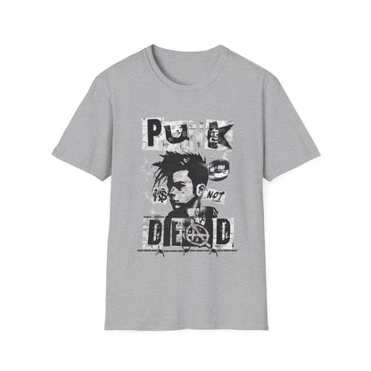 A sport grey streetwear t-shirt featuring a bold black ink collage graphic. The design includes a cropped portrait of a person with a mohawk, an anarchy symbol, jagged stars, and barbed wire accents. The phrase 'PUNK IS NOT DEAD' is spelled out in large, spiky, distressed block lettering across the design.