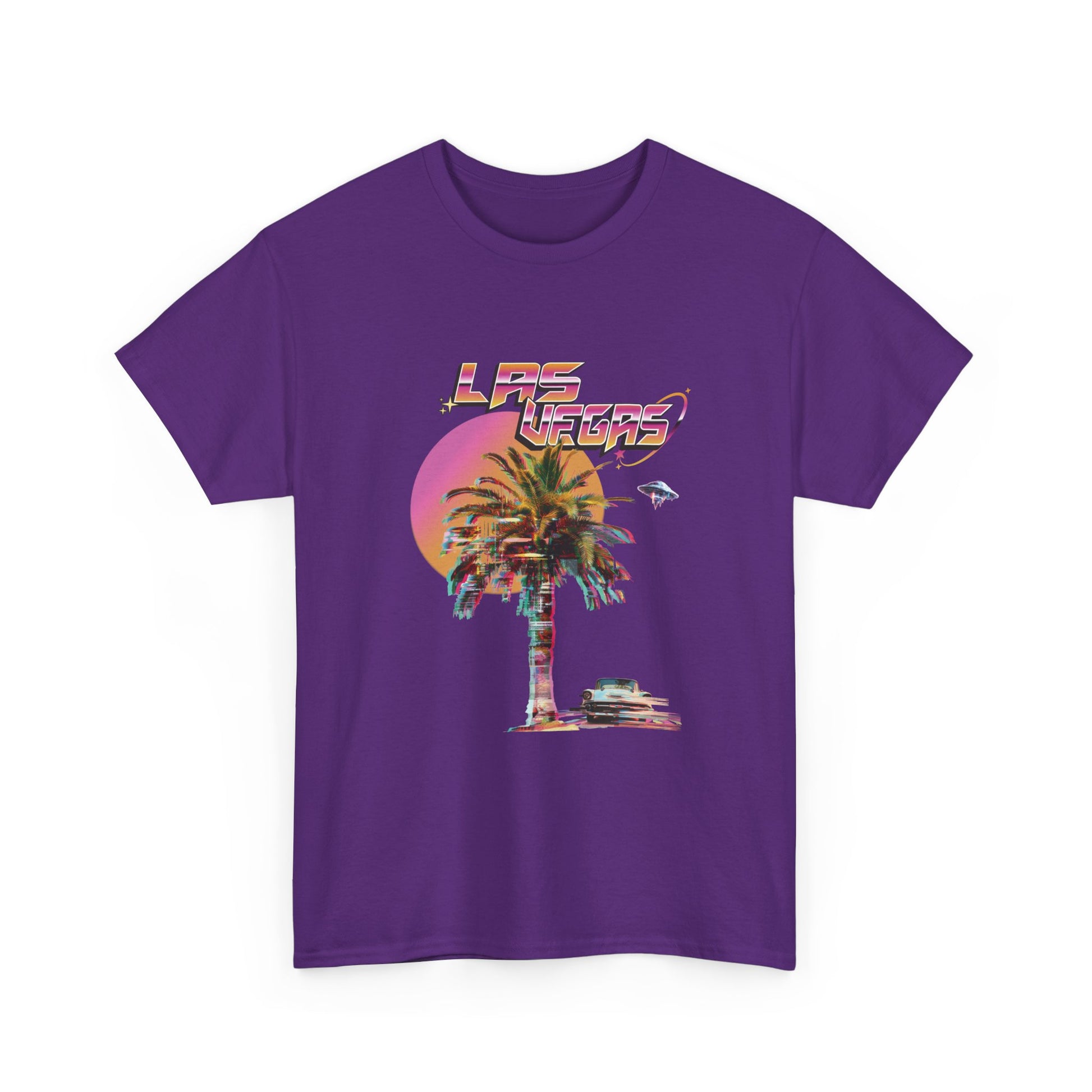 A purple t-shirt with a retro glitch Las Vegas graphic featuring a palm tree, a sunset, and UFOs over a desert landscape.