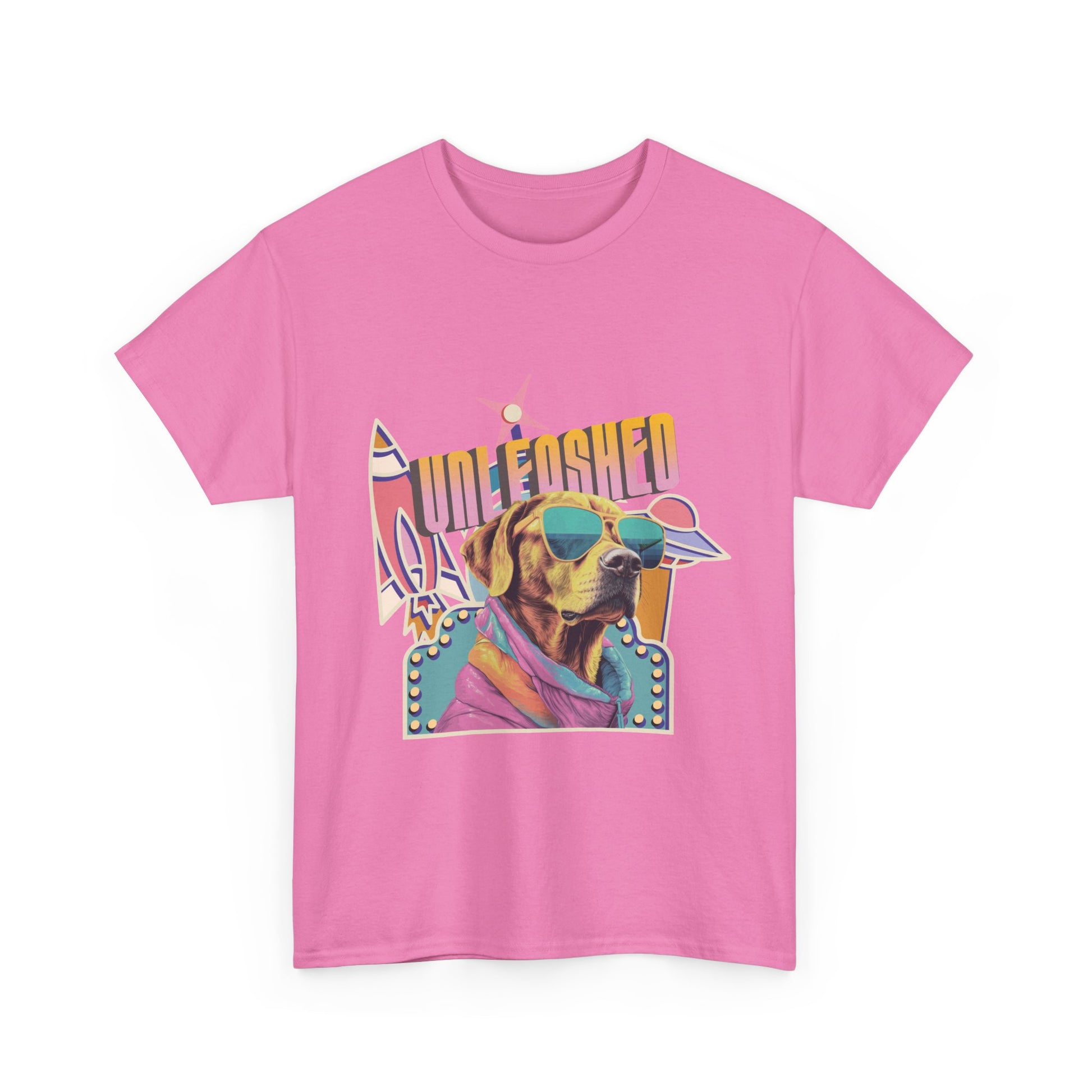 pink t-shirt with a colorful vintage spaceship graphic of a dog wearing sunglasses and text that reads 'Unleashed'.