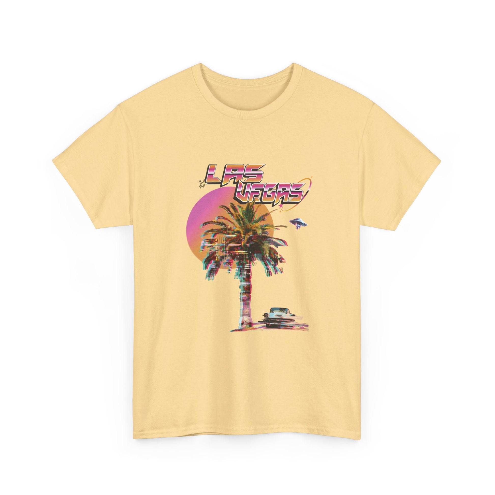 A light yellow t-shirt with a retro Las Vegas glitch graphic featuring a palm tree, a sunset, and UFOs over a desert landscape.