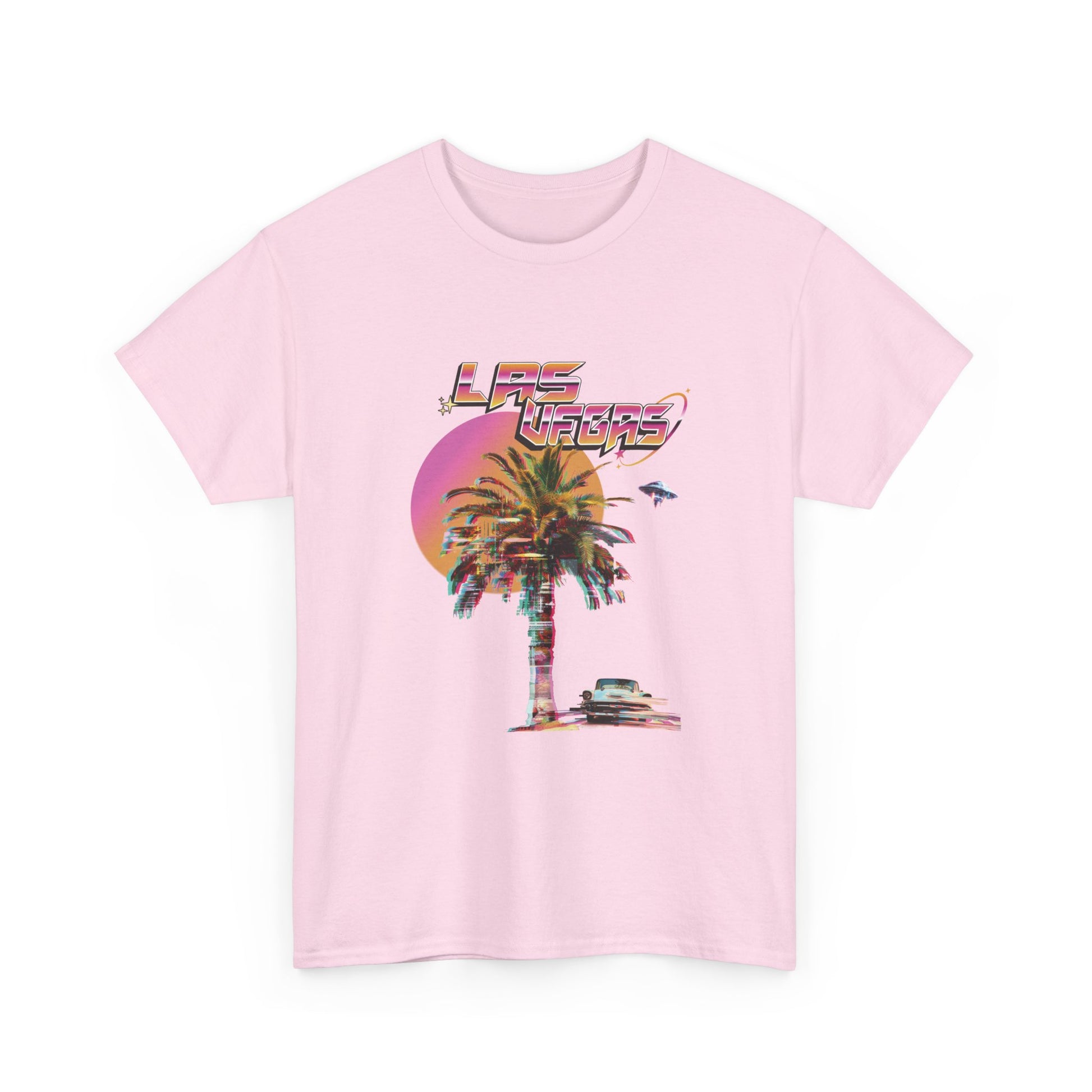 A light pink t-shirt with a retro Las Vegas glitch graphic featuring a palm tree, a sunset, and UFOs over a desert landscape.