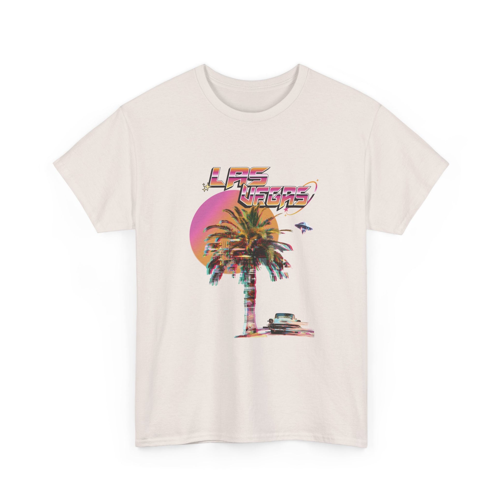 A light gray t-shirt with a retro Las Vegas glitch graphic featuring a palm tree, a sunset, and UFOs over a desert landscape.