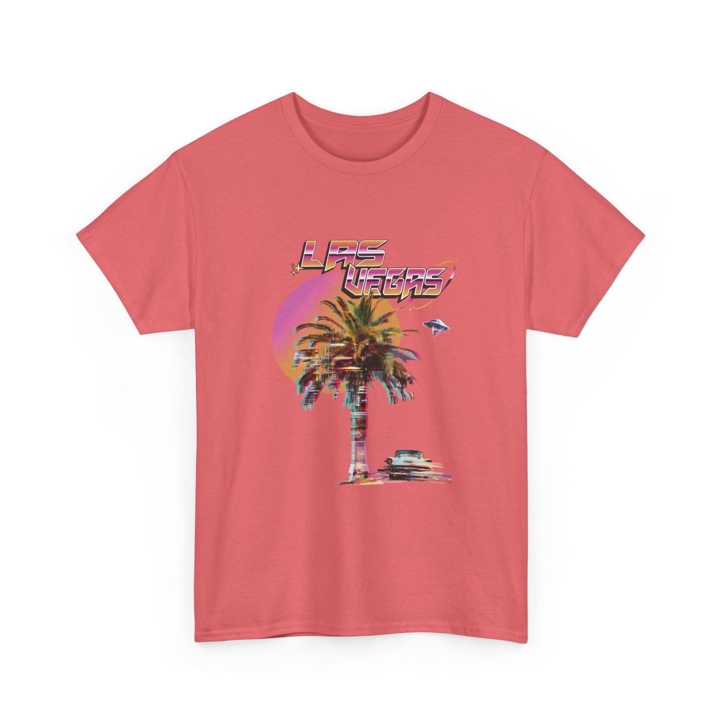 A coral t-shirt with a retro Las Vegas glitch graphic featuring a palm tree, a sunset, and UFOs over a desert landscape.
