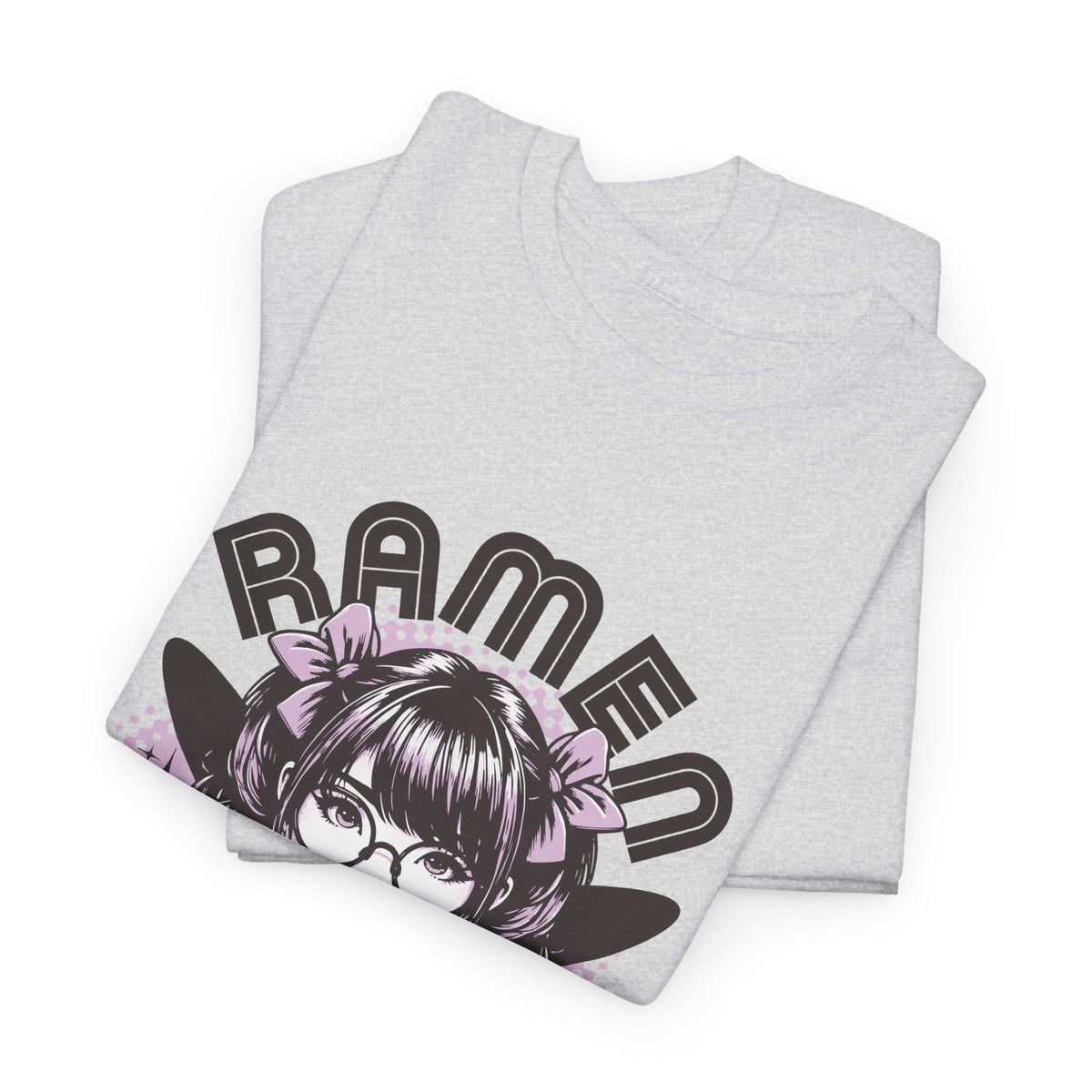 A folded Ash gray heather t-shirt featuring a graphic print of an anime girl with glasses and a pink bow, with the word 'RAMEN' printed in bold black letters.