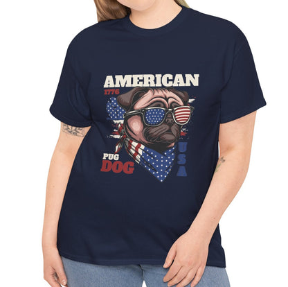 A woman wearing a navy blue graphic t-shirt with a patriotic 'American Pug Dog USA' design featuring a pug wearing sunglasses and a bandana. The model is cropped from the neck down, wearing light blue jeans against a plain white background.