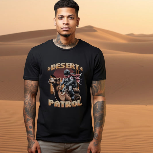 Man wearing a black t-shirt with 'Desert Patrol' graphic in a desert setting