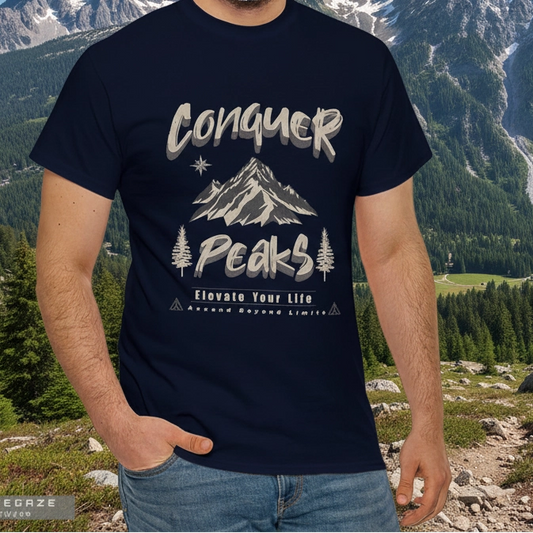 Person wearing a navy blue t-shirt with mountain design and text in a mountainous landscape