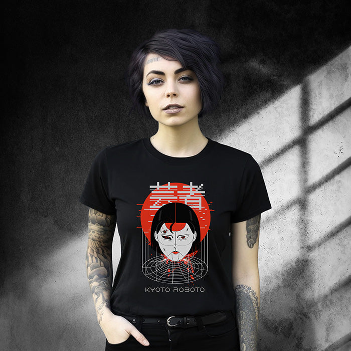 A young woman wearing a black t-shirt with a graphic design of a Japanese cyber woman against a red sun with text "Kyoto Roboto".