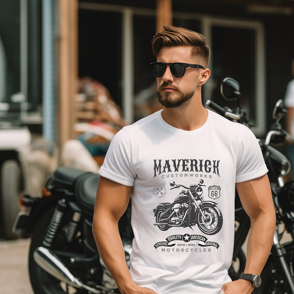 Man wearing a white t-shirt with a motorcycle graphic and 'Maverick Customworks' text, standing in front of motorcycles.
