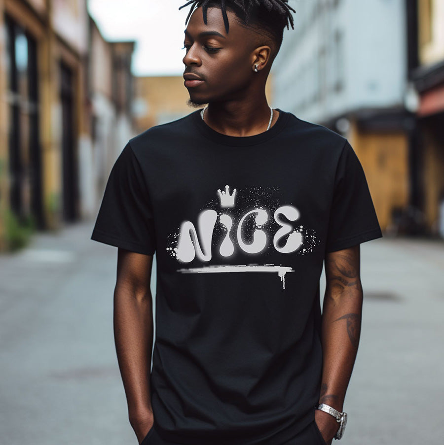 Person wearing a black t-shirt with 'NICE' printed on it in an urban setting