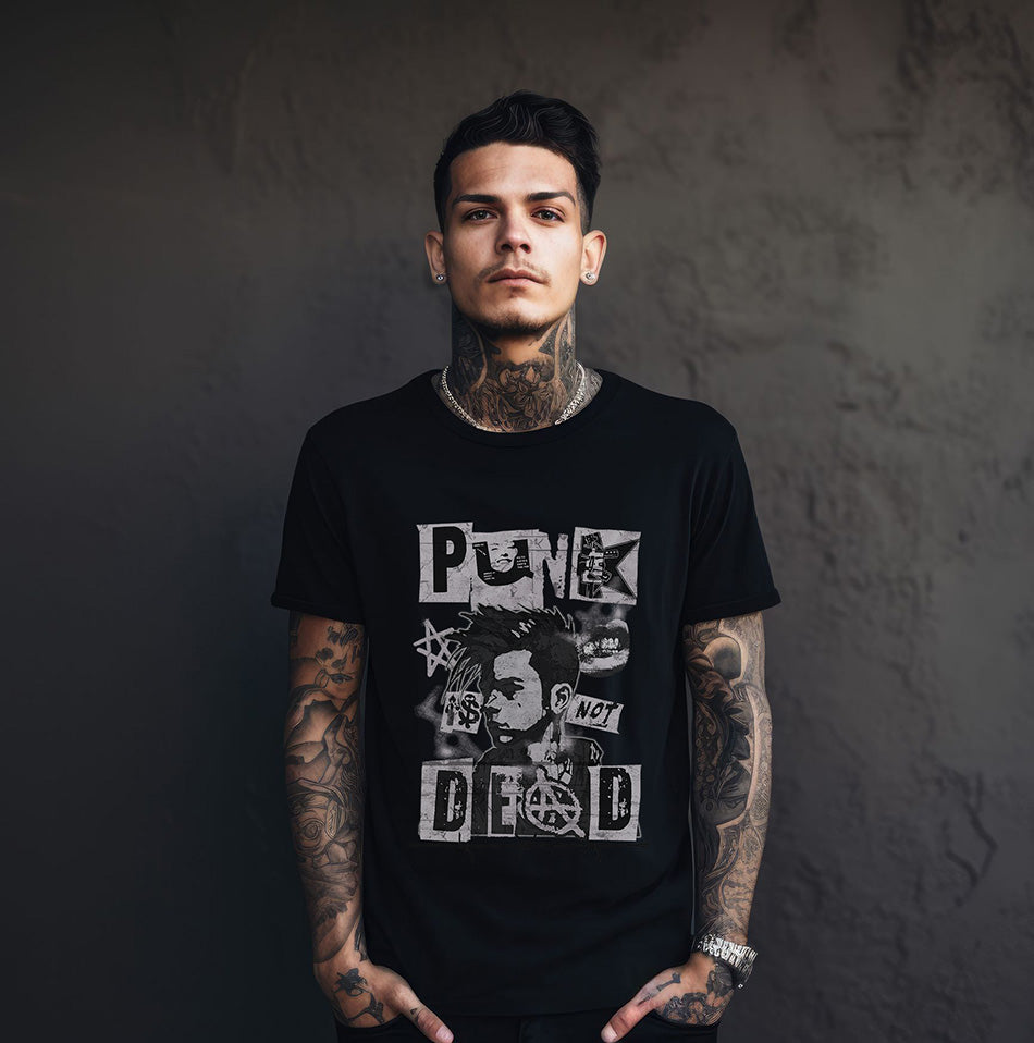 A man wearing a black t-shirt with graphic design that says 'Punk is not dead'.