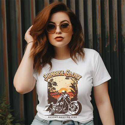Woman wearing a white t-shirt with a motorcycle graphic and 'Sunrise Glory' text.