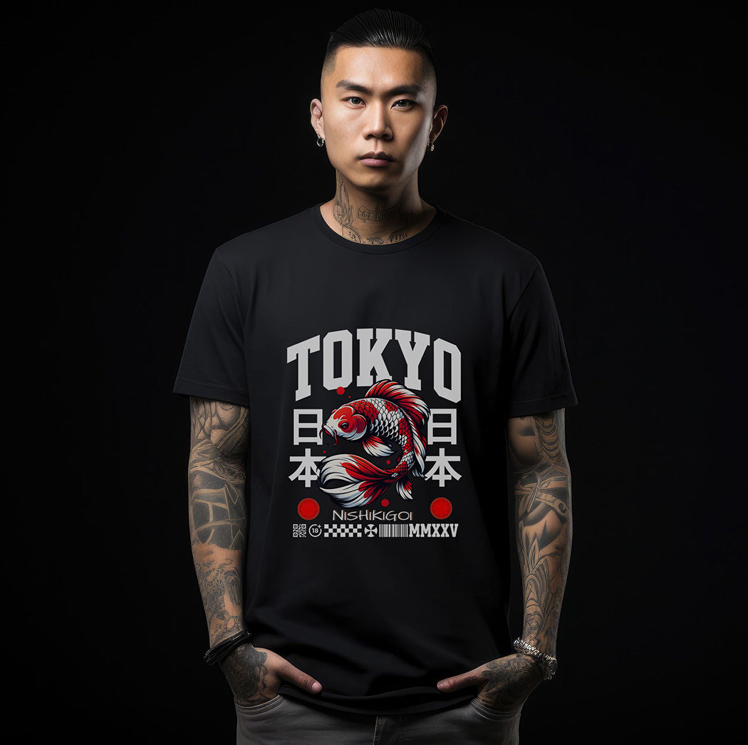 Man wearing a black streetwear t-shirt featuring a central graphic of a detailed koi fish, with 'TOKYO' in bold white block lettering above and Japanese kanji characters for 'Japan' on either side. Small technical typography and a barcode design are printed at the bottom. 