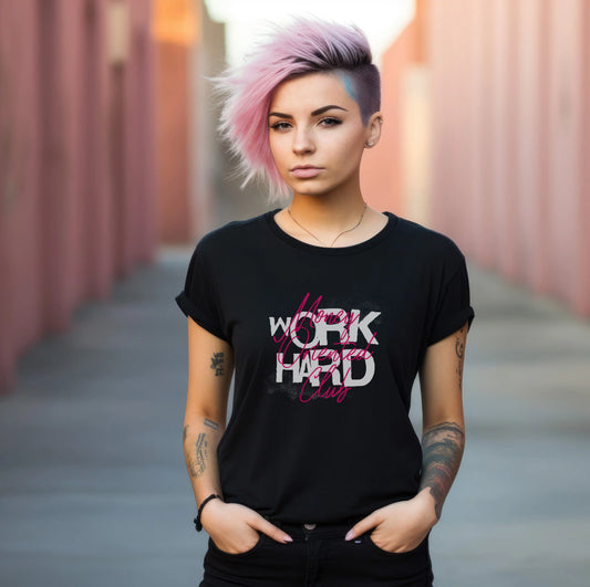 Person wearing a black t-shirt with motivational text, standing in an urban setting.
