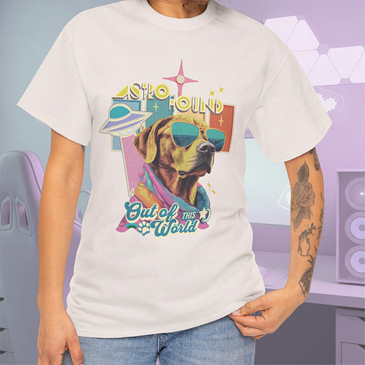 Person wearing a t-shirt with a dog graphic and text 'Out of This World' on a colorful background.